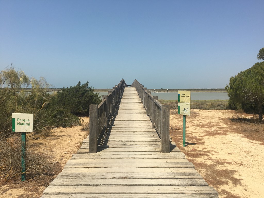 Crossing the river on an enormous wooden bridge.